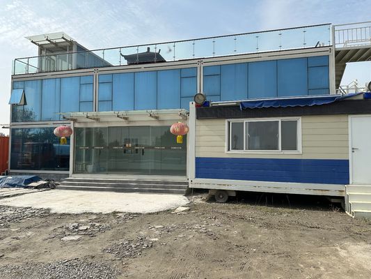 Installazione rapida personalizzata Casa modulare a pacchetto piatto con elevata velocità del vento e 15-30 anni di vita in vari colori